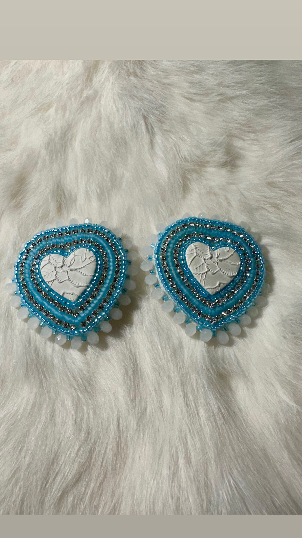 White and blue heart shaped beaded earrings